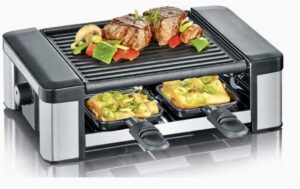 urządzenie racletton, na którym smażą się dwa steki