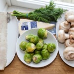 sandacz filet, brukselka, pieczarki, pęczek koperku, ser twardy